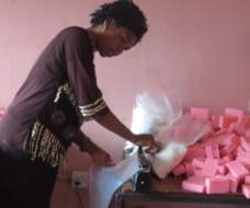 A beneficiary of Enterprising Women in her Home Soap factory